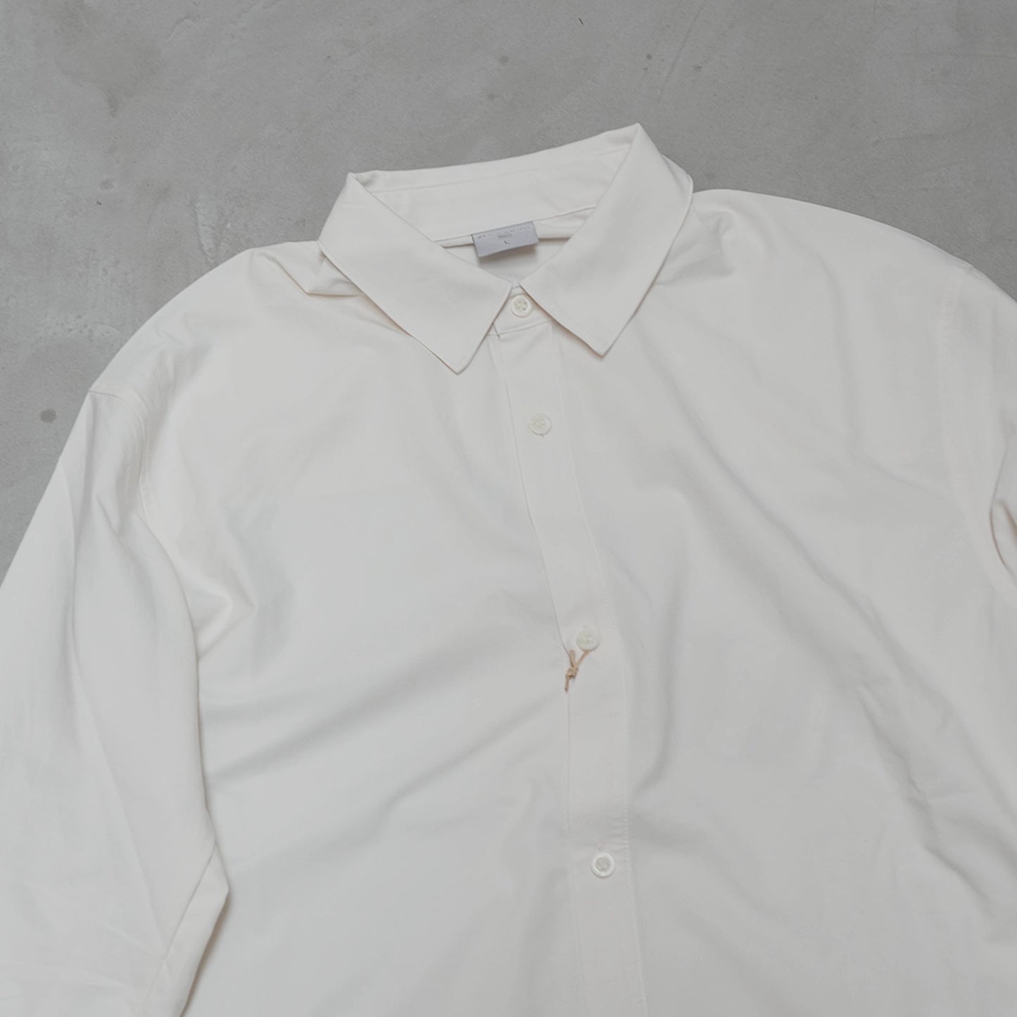 【HOUDINI】フーディニ men's Symbio Base Shirt "Paper White"