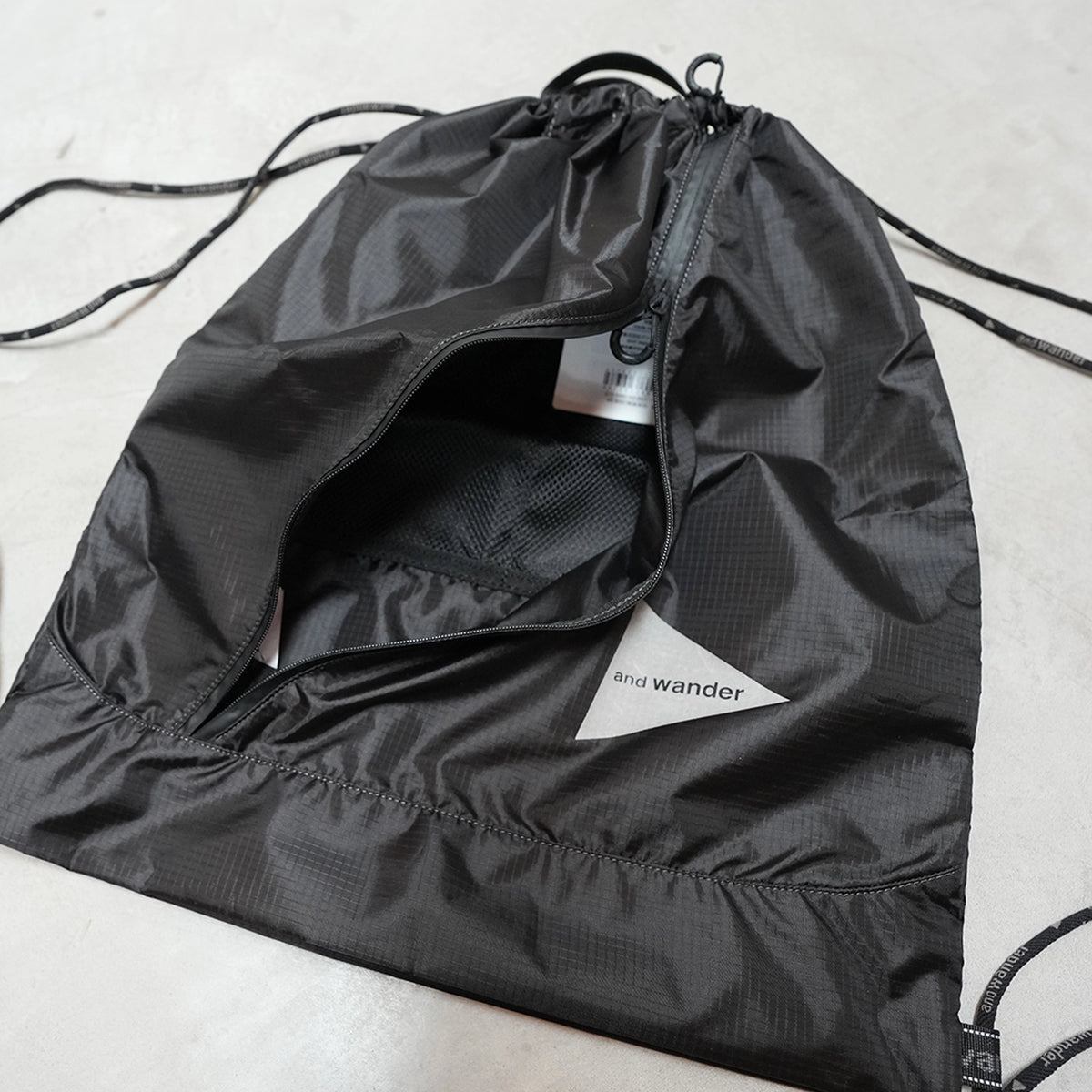 【and wander】アンドワンダー crispy rip drawstring bag "2Color" ※ネコポス可