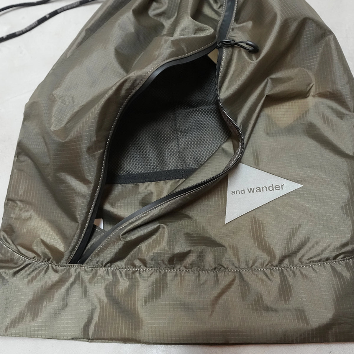 【and wander】アンドワンダー crispy rip drawstring bag "2Color" ※ネコポス可