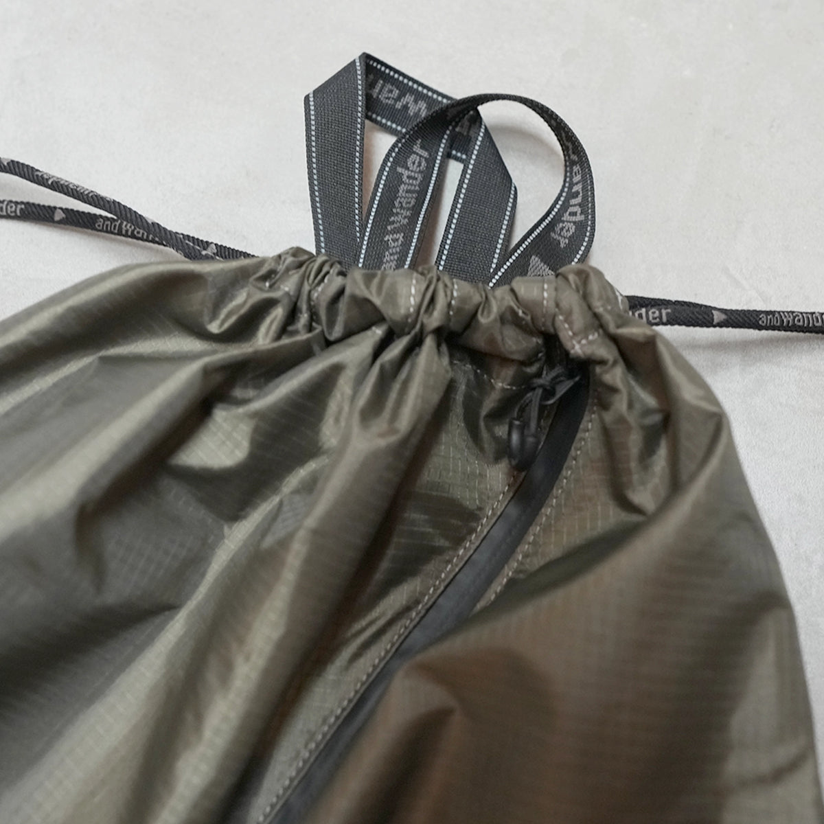【and wander】アンドワンダー crispy rip drawstring bag "2Color" ※ネコポス可