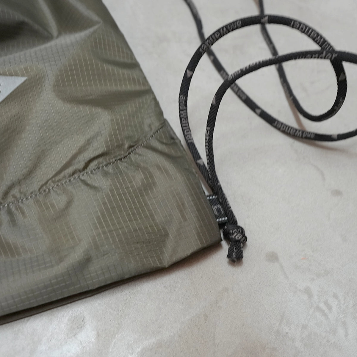 【and wander】アンドワンダー crispy rip drawstring bag "2Color" ※ネコポス可
