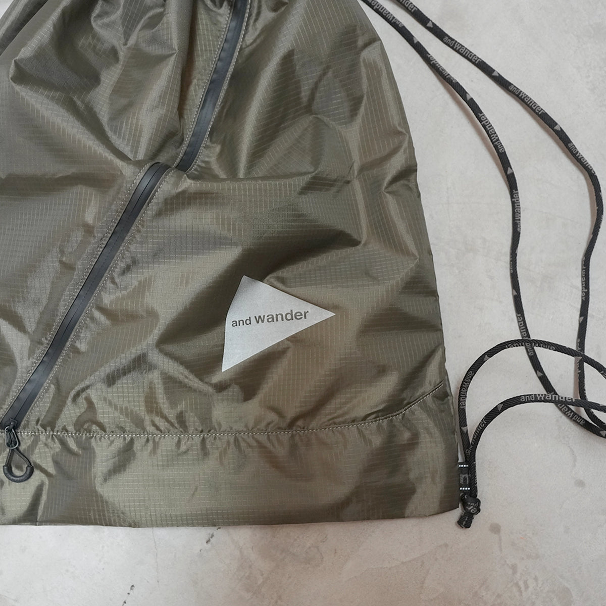 【and wander】アンドワンダー crispy rip drawstring bag "2Color" ※ネコポス可